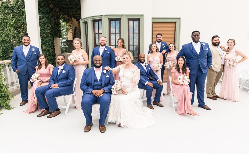 Large bridal party in navy and pink
