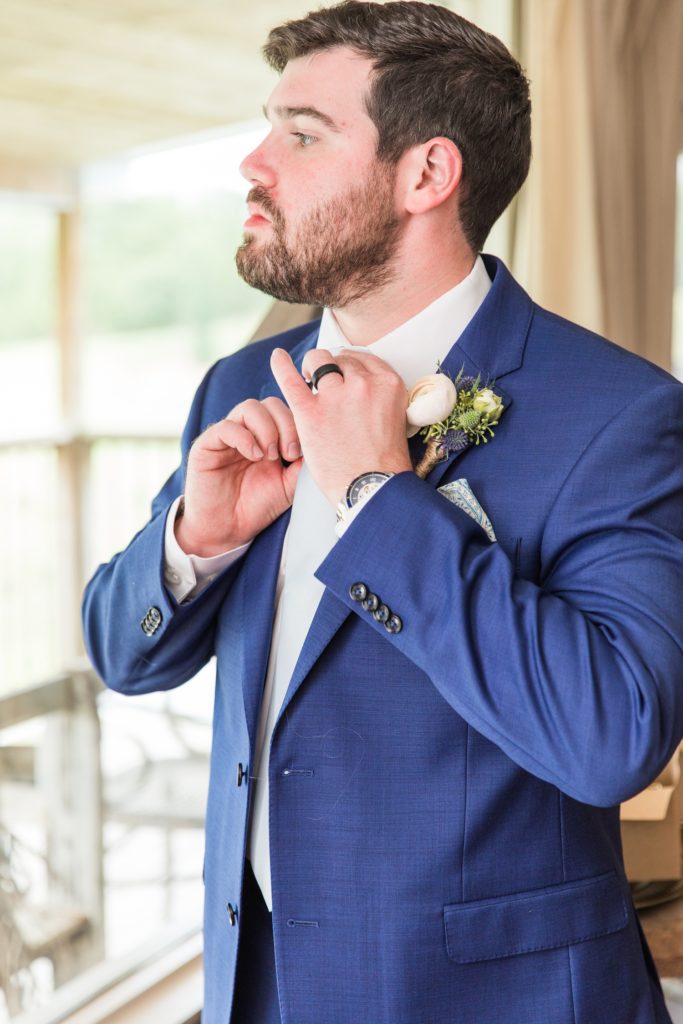 Groom getting ready blue suit Alabama wedding Flagstone farm groom suite