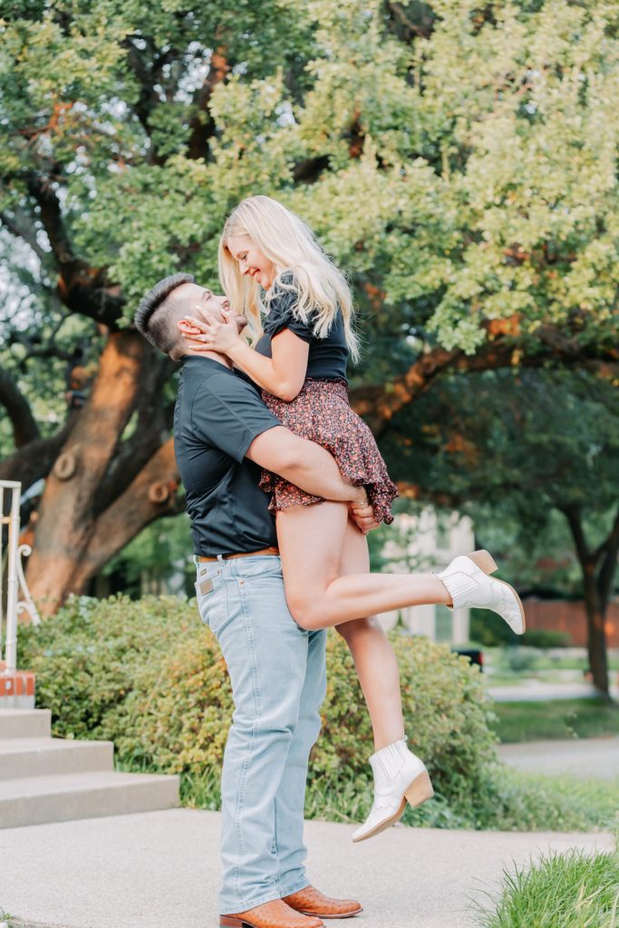 Couple lift engagement portrait Flippen Park in North Dallas Texas.