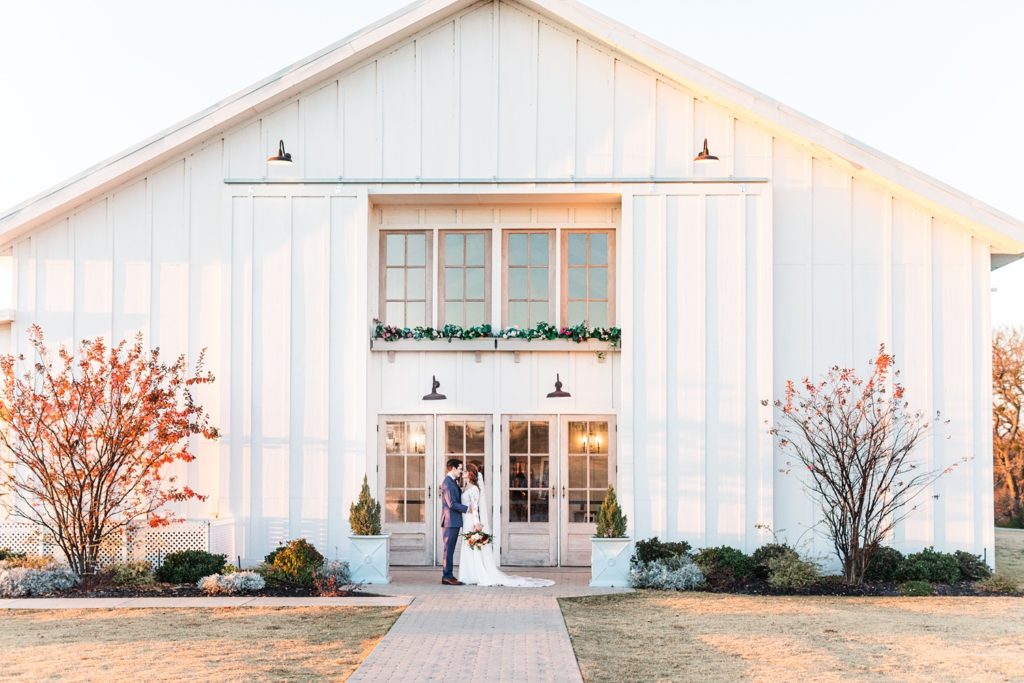 Wedding portrait in front of Grand Ivory Barn in DFW