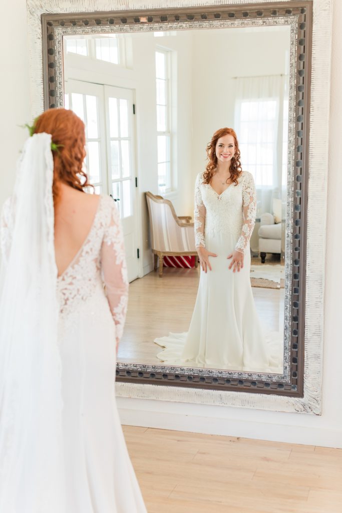 Brides last look in the mirror before the ceremony