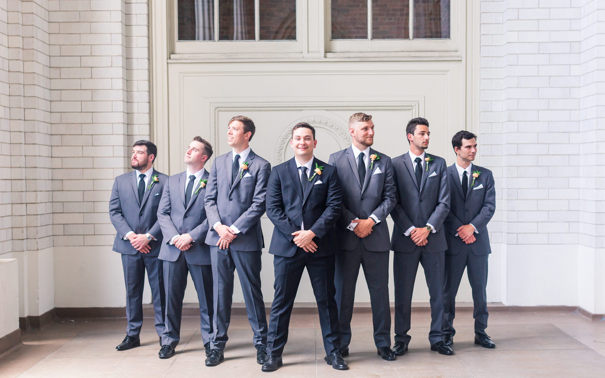 Grooms and groomsmen group portrait in blue suits