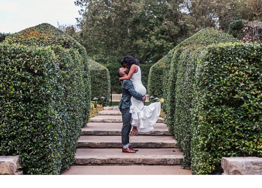 Engagement photos on stairs at the Dallas Arboretum